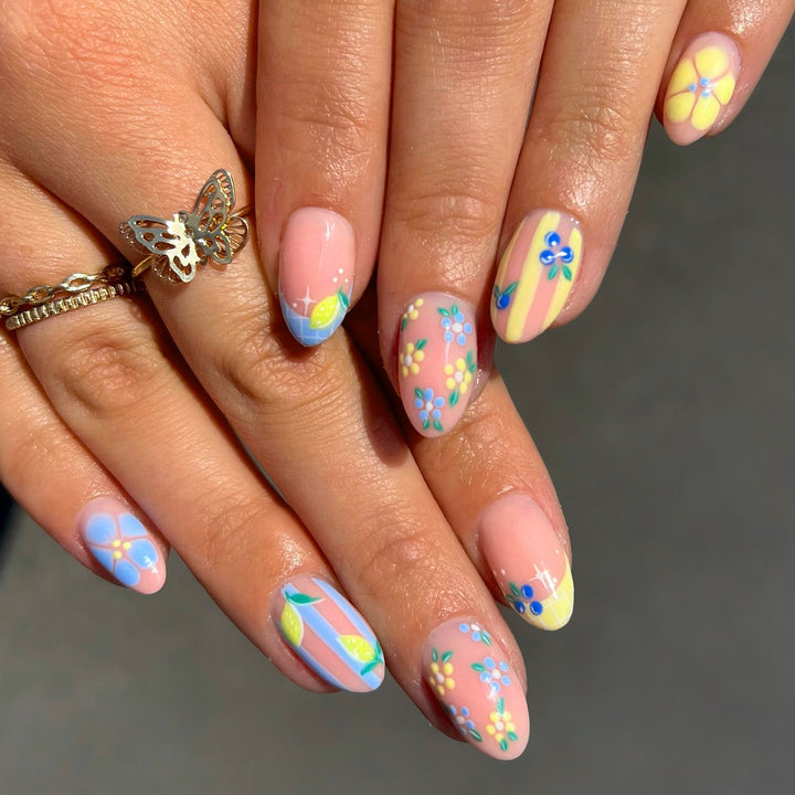Artistic 3D nail art with cheerful floral designs Bowlift