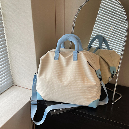 Fashionable Travel Bag with Ergonomic Carrying Strap and Structured Interior Bowlift