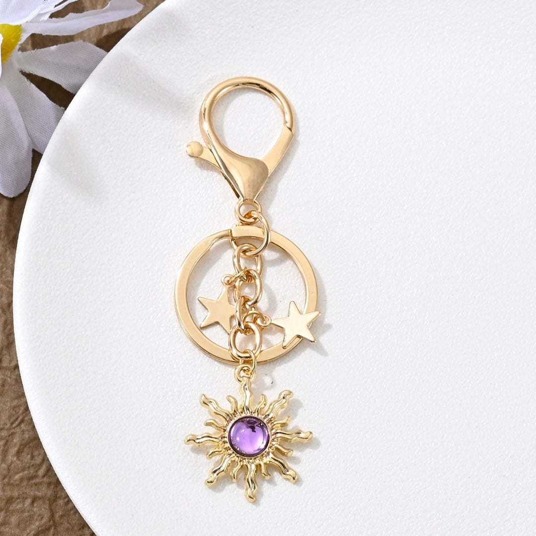 Keychain with Sparkling Sun Motif Bowlift