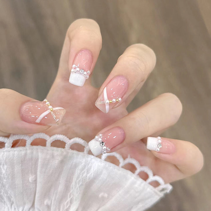 Artificial nails with heart design and glamorous accents Bowlift