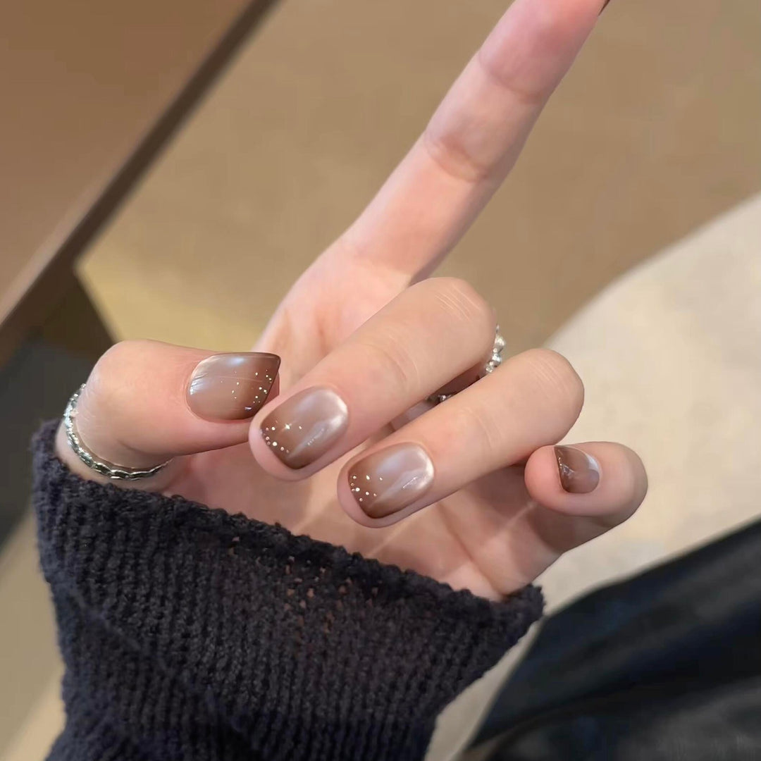 Artificial nails with elegant gradient color and glitter elements Bowlift