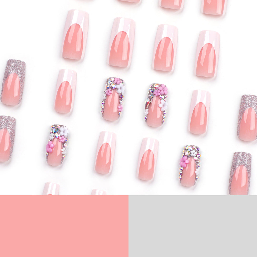 Artificial nails with floral decorations and glitter effects Bowlift