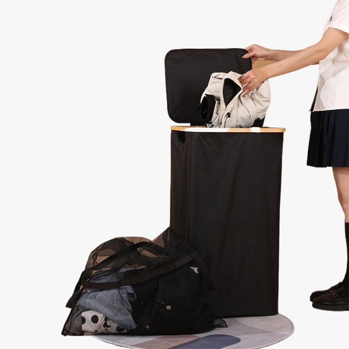 Elegant laundry container with practical lid and carrying system Bowlift