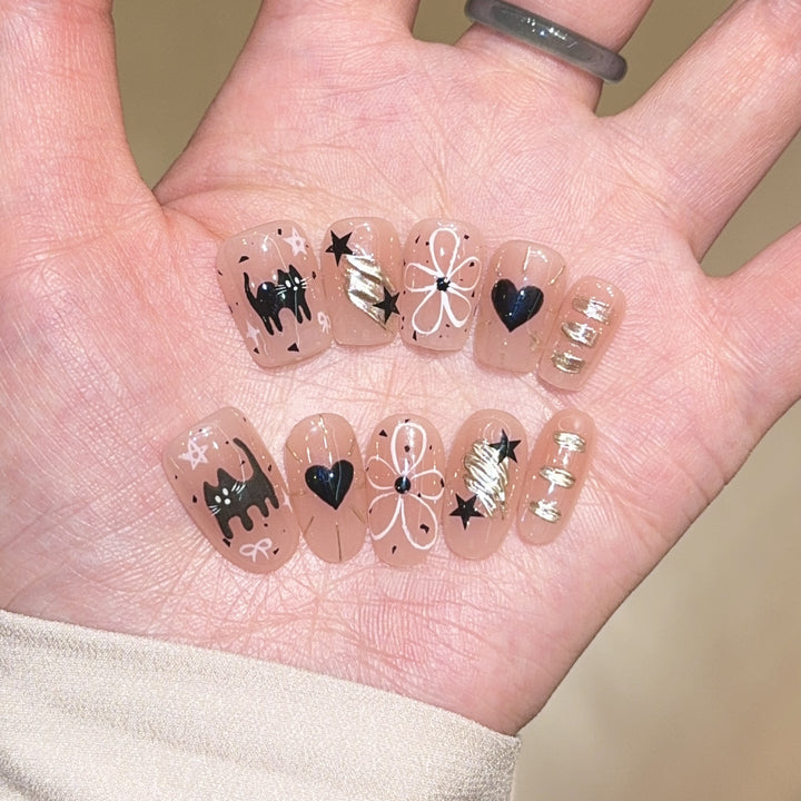 Artificial nails with unique cat and star design Bowlift