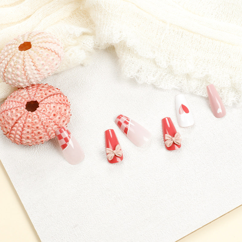 Artful nail extensions with playful designs and romantic accents Bowlift