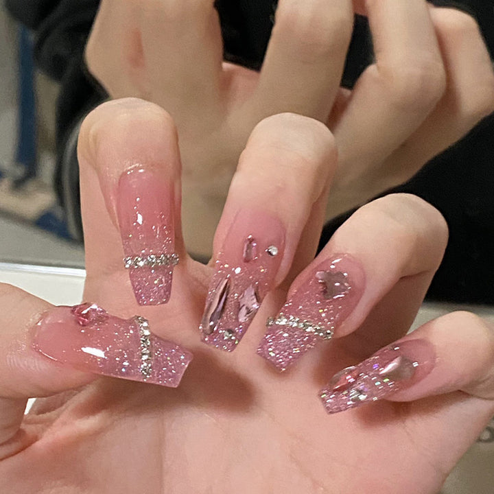 Artificial nails with heart design and glitter accents Bowlift