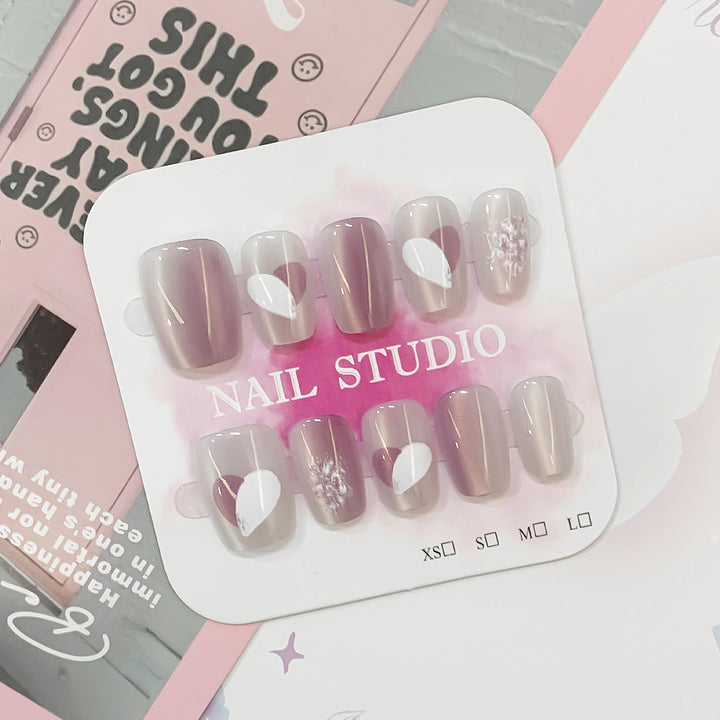 Artistic acrylic nails with heart-shaped accents Bowlift