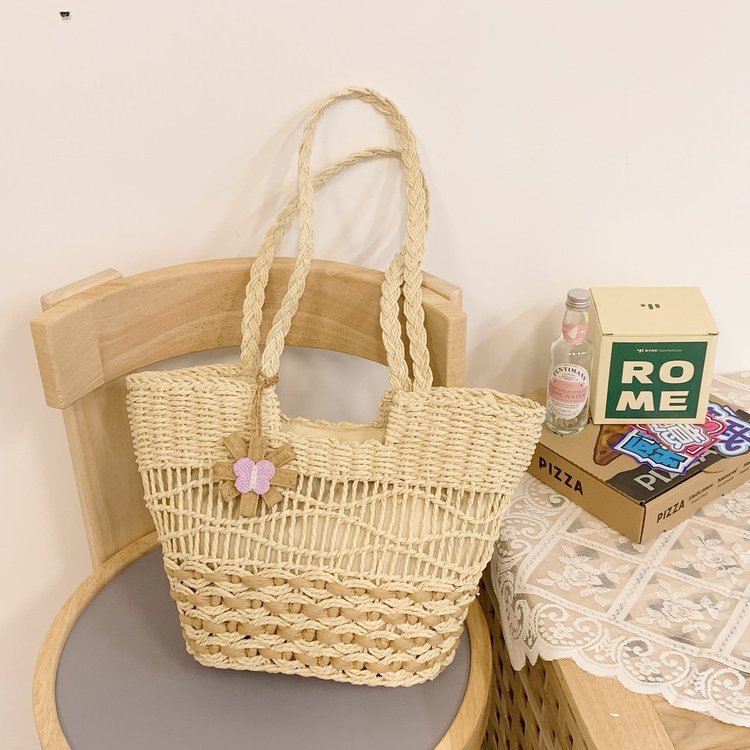Handwoven beach bag with floral accents Bowlift