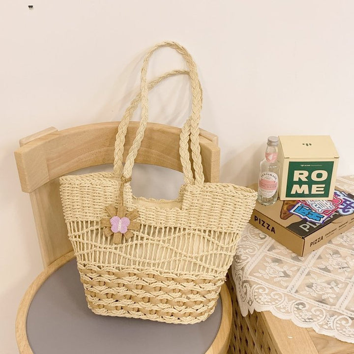 Handwoven beach bag with floral accents Bowlift