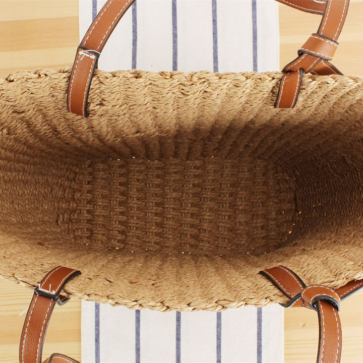 Beach bag made of handwoven natural material with sturdy leather straps Bowlift