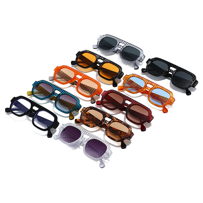 Ladies fashionable sunglasses in futuristic design with textured frame Bowlift