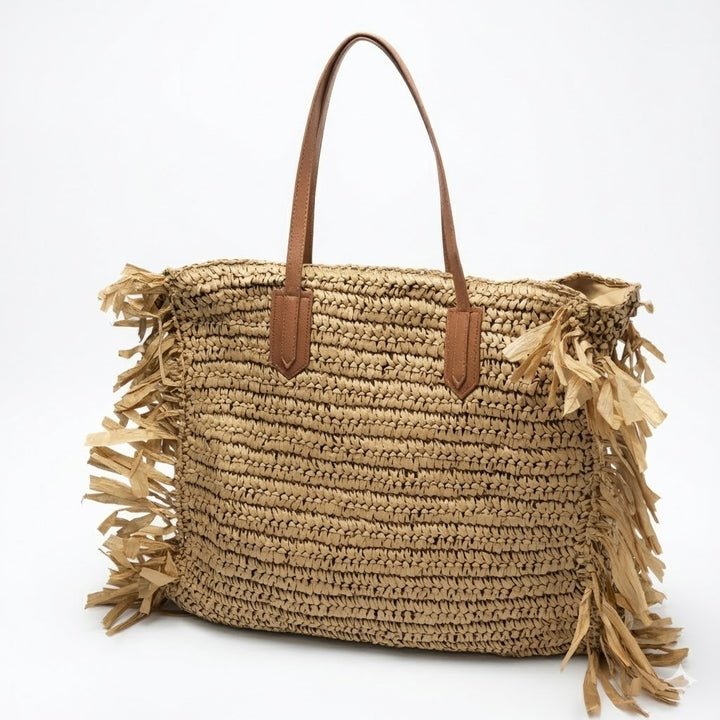 Beach bag with fringed design and sturdy leather handles Bowlift