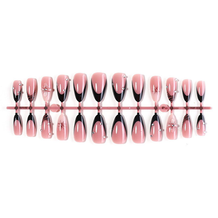 Acrylic nail set with elegant glitter and flower accents Bowlift