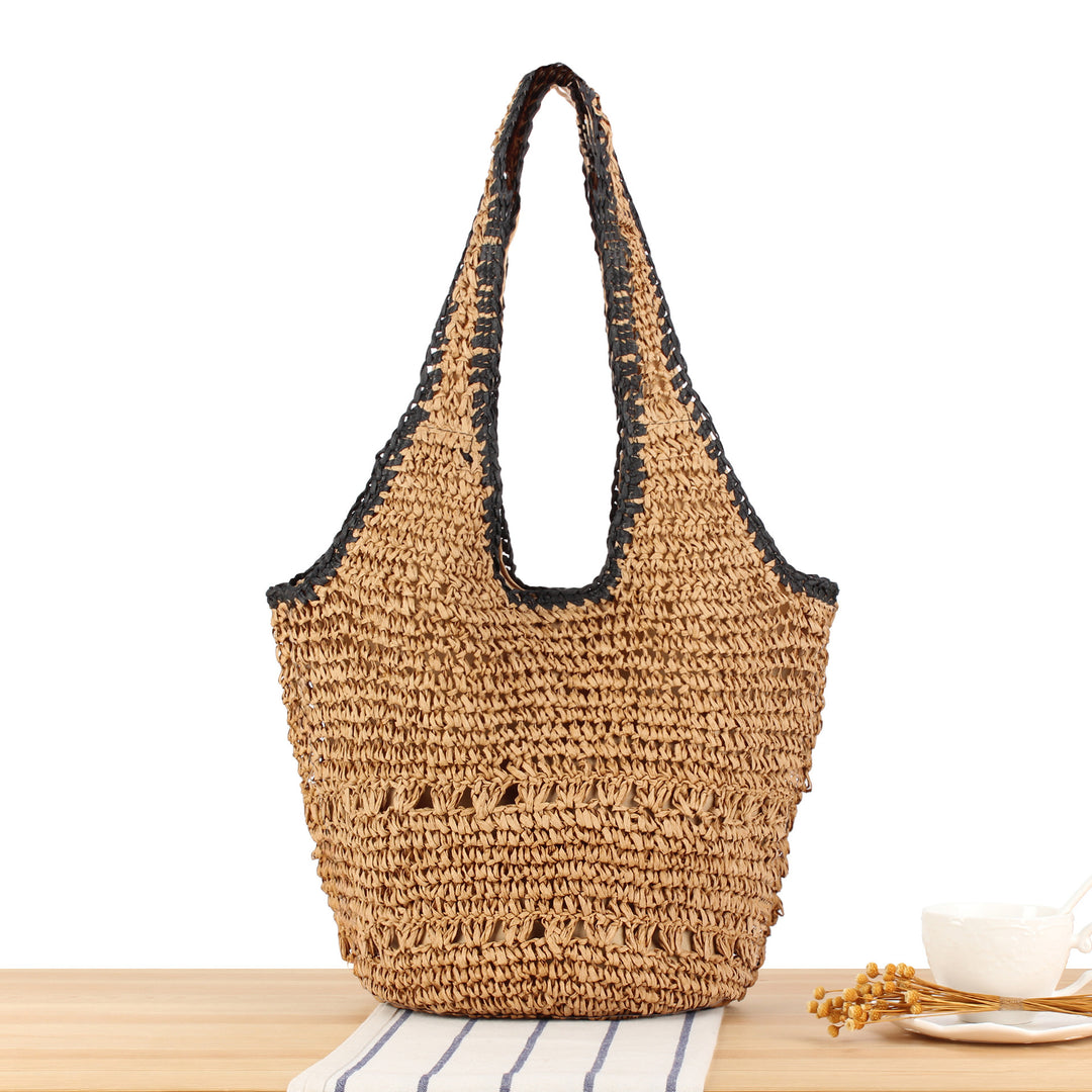 Beach shoulder bag made of handwoven natural material with comfortable carrying handles Bowlift