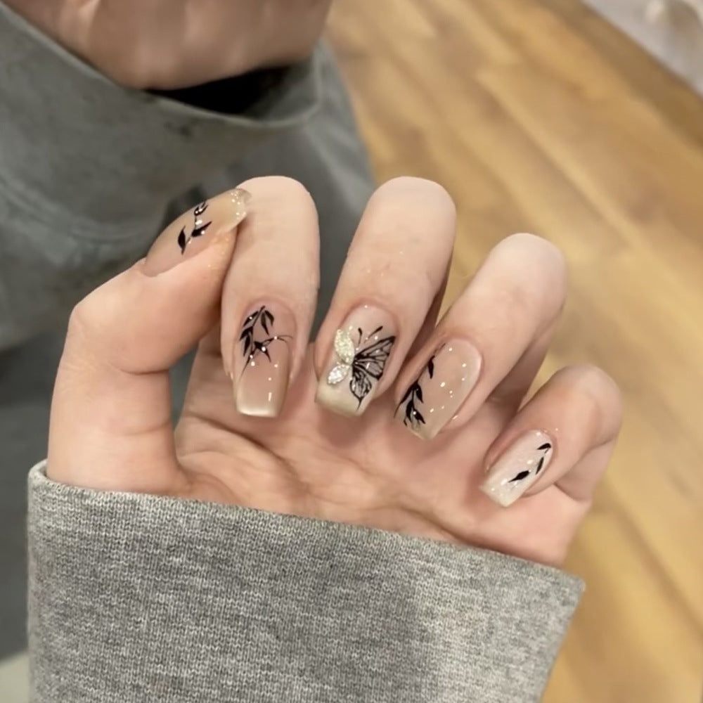 Artificial nail extensions with floral butterfly design Bowlift