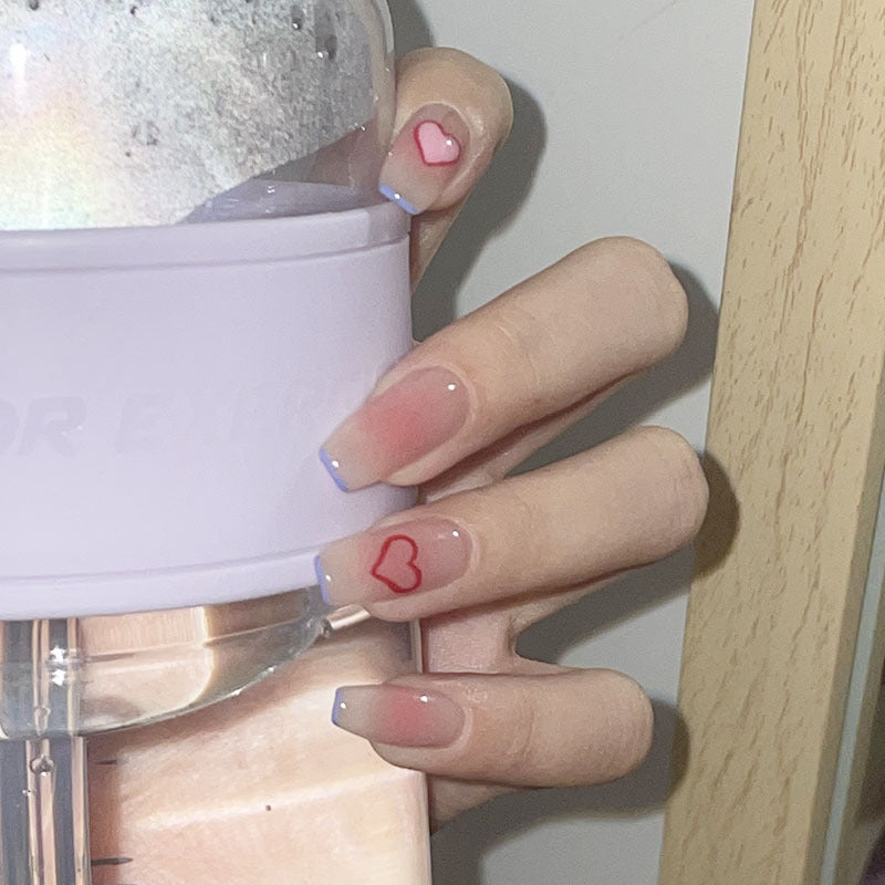 Artificial nails with heart accent and glamorous decorations Bowlift