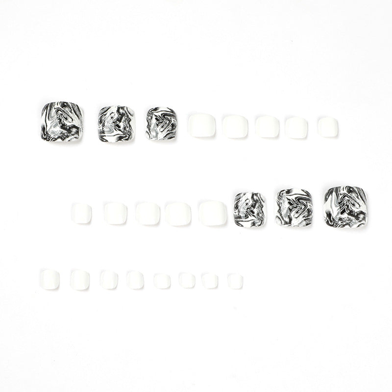 Artful toenail art in elegant marble design Bowlift