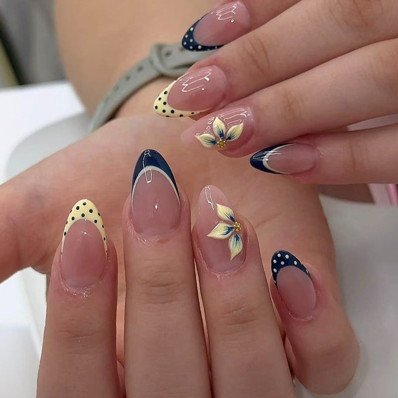 Artful nail tips with floral accent Bowlift