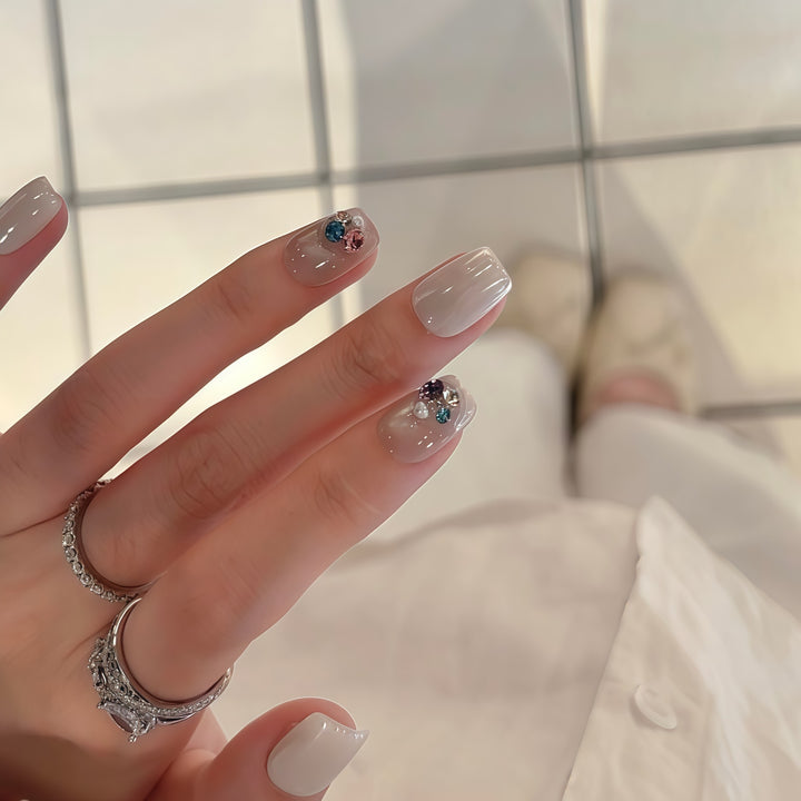 Artificial nails with elegant jewelry accents Bowlift