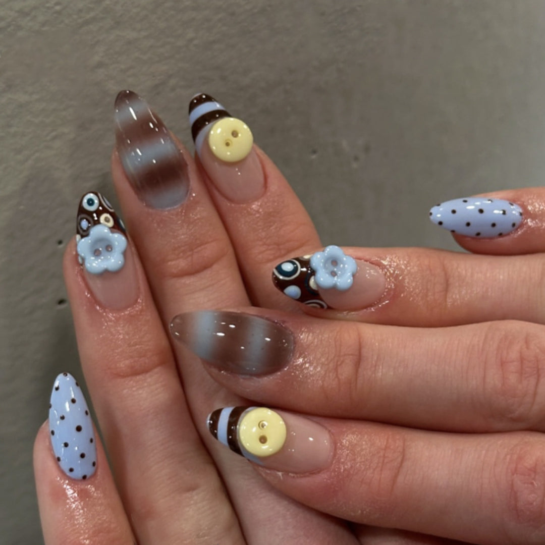 Artful stiletto nails with elegant floral design and glitter details Bowlift
