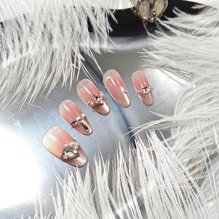 Artificial nails with luxurious jewelry accents Bowlift