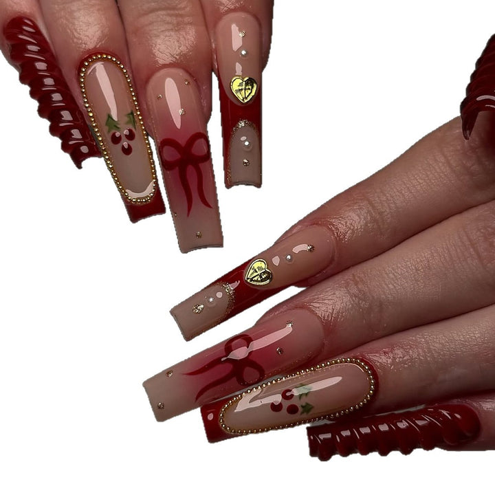 Artificial nail set with festive accents and glitter embellishments Bowlift