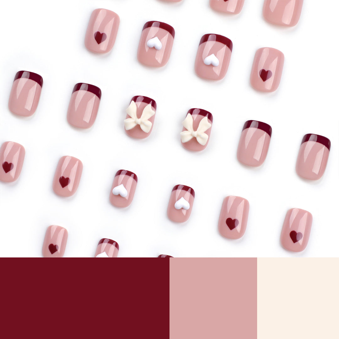 Artful nail art with heart and bow motifs Bowlift