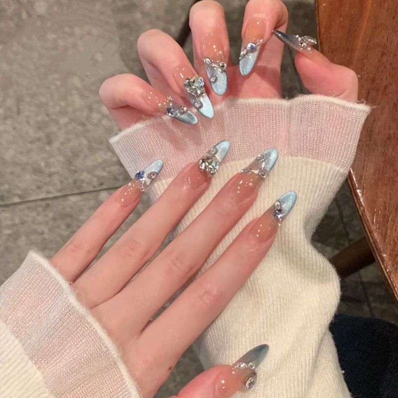 Acrylic nail set with elegant tips and glamorous rhinestone accents Bowlift