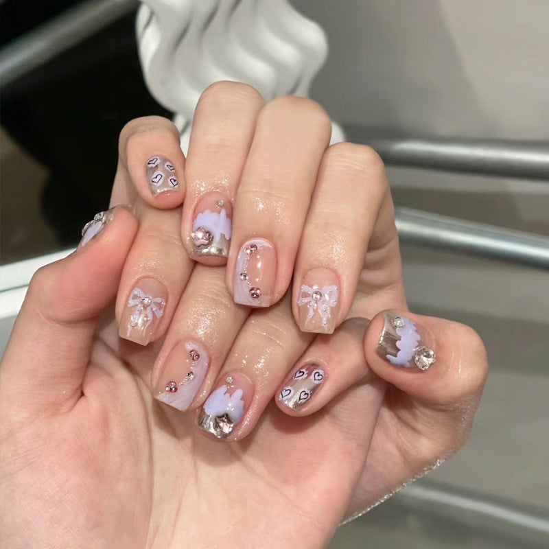 Artistic Press-On Nail Set with Floral and Heart Designs Bowlift