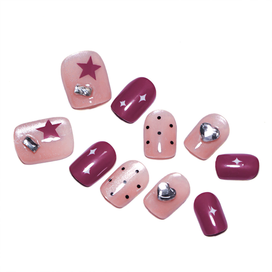 Artificial nail extensions with unique jewelry accents Bowlift