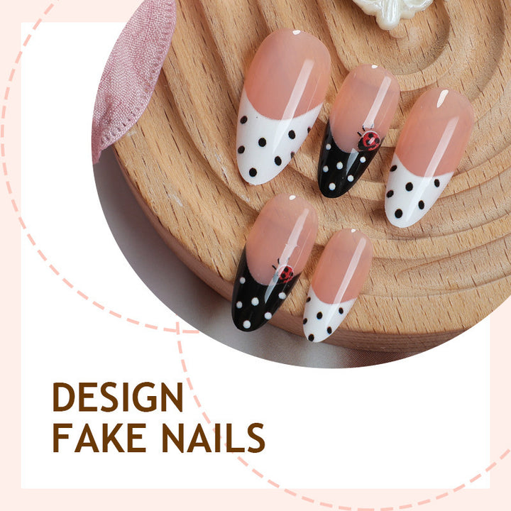 Acrylic nail set with polka-dotted accents and sparkling details Bowlift