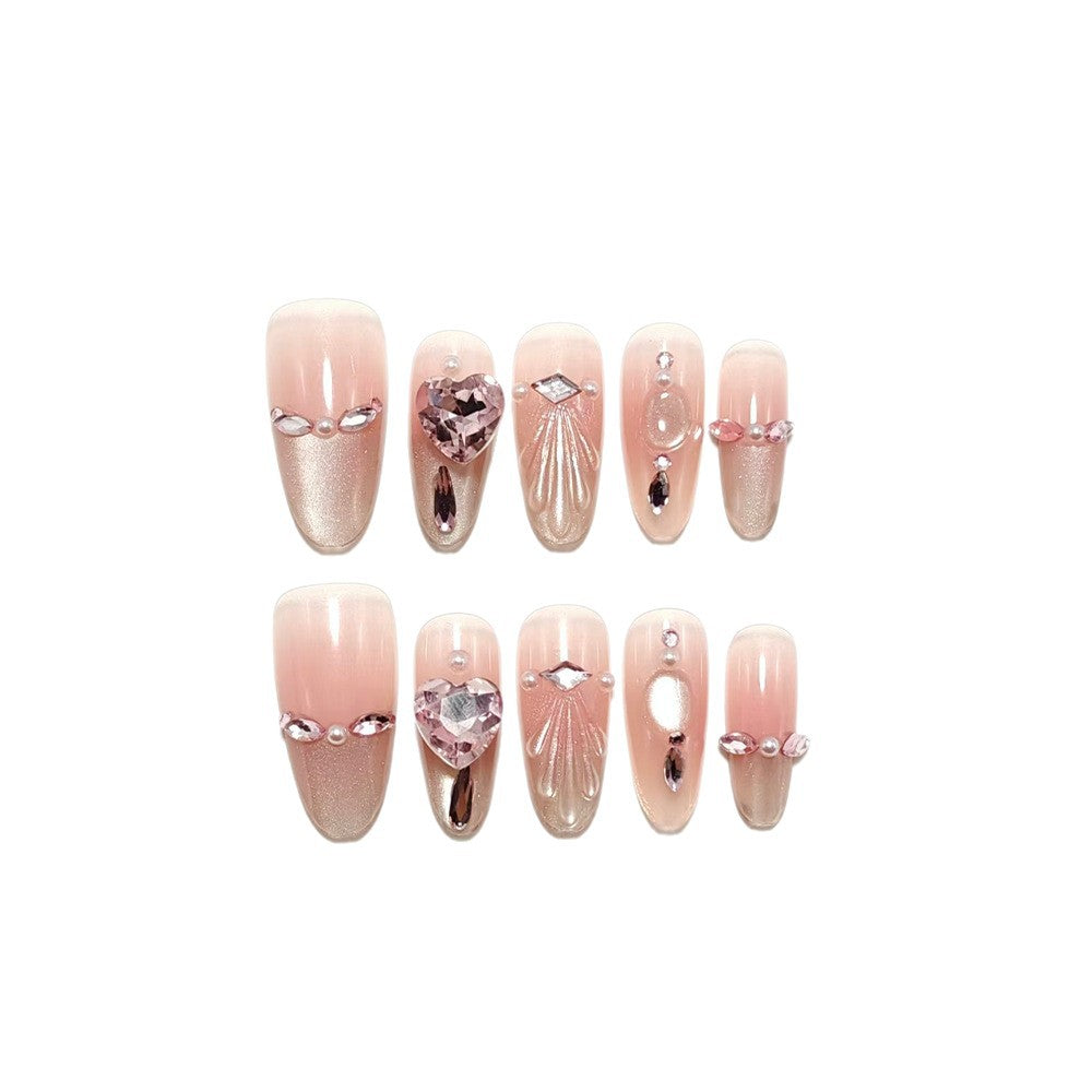 Artificial nails with sparkling heart and rhinestone accents Bowlift