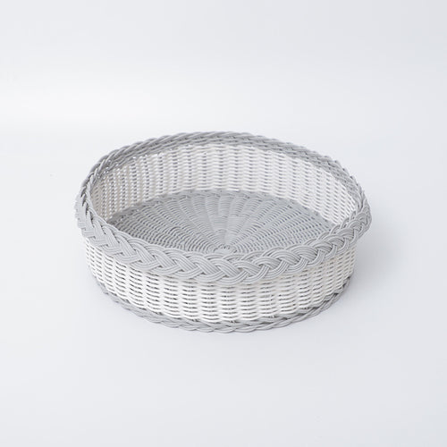 Handwoven storage basket with decorative edge