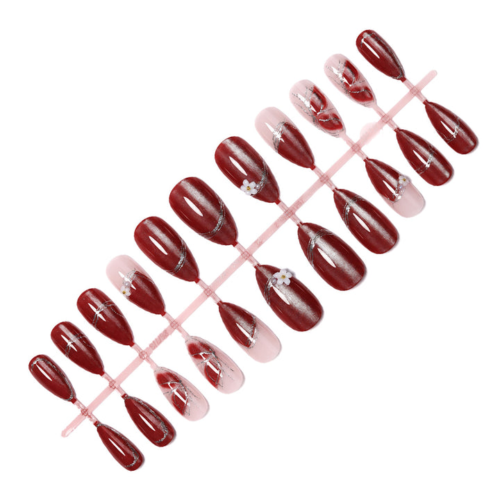 Decorative Press-On Nail Art with Floral Accents Bowlift