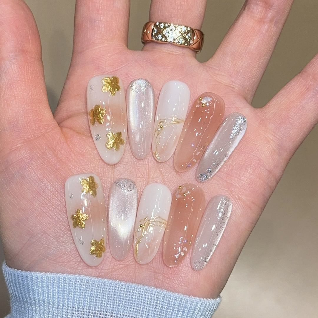 Artificial nails with floral decorations and glitter effects Bowlift