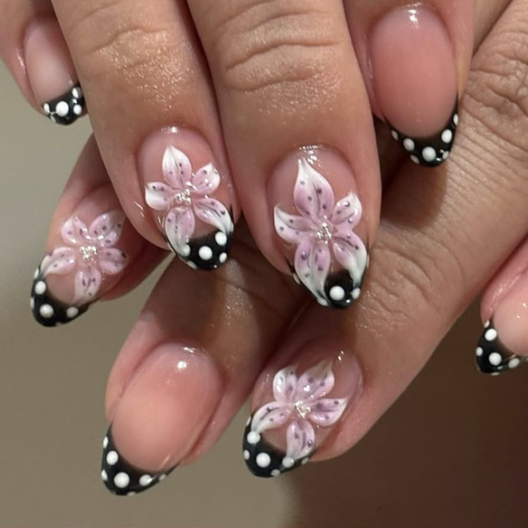 Artistic nail art with floral designs and elegant accents Bowlift