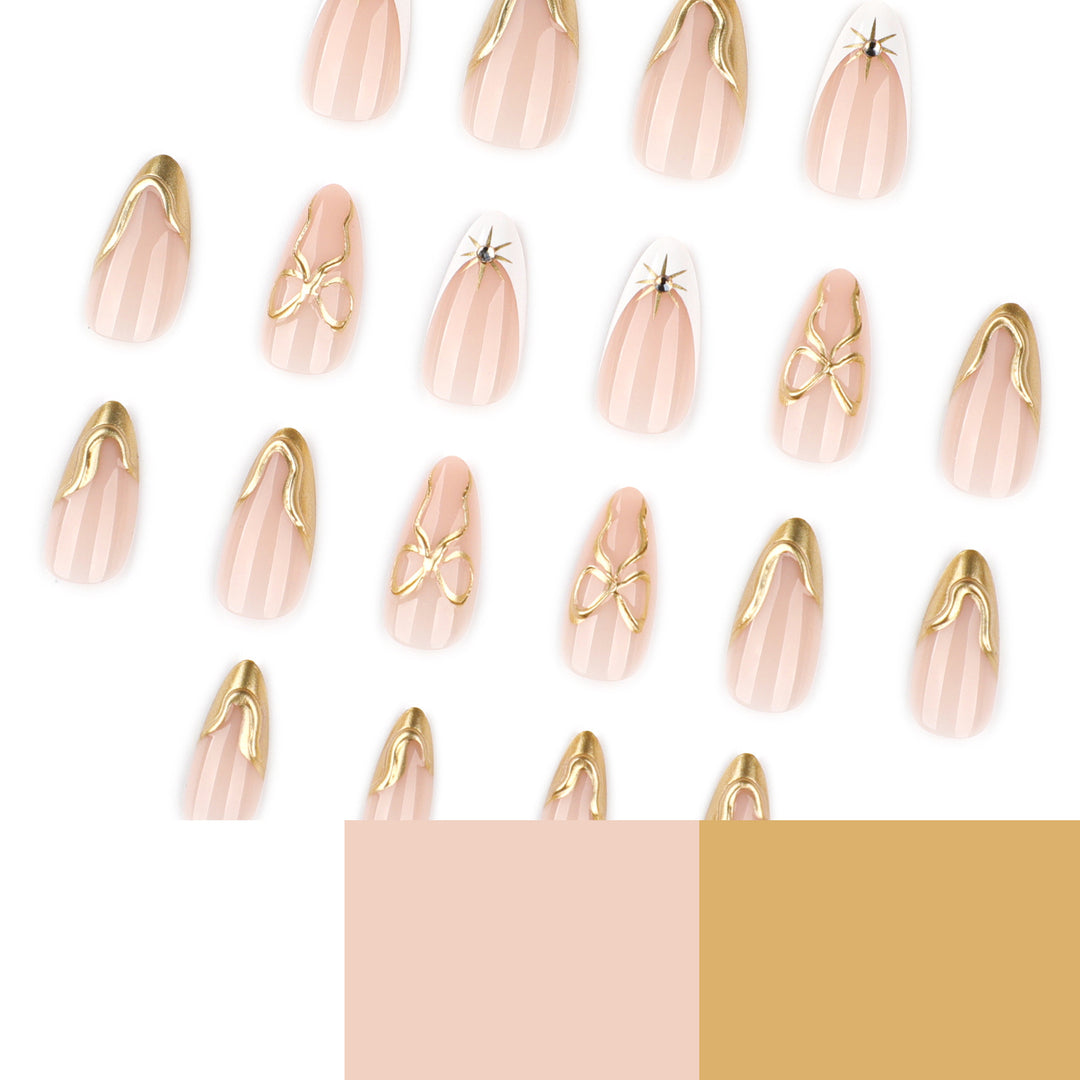 Artistic stiletto nails with elegant gold accents Bowlift