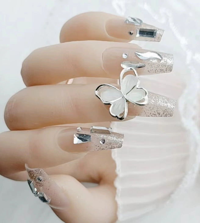 Elegant nail design with pearl embellishment Bowlift