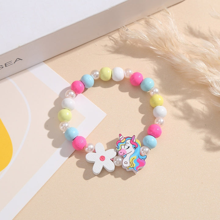 Playful children's bracelet with unicorn and flower motif Bowlift