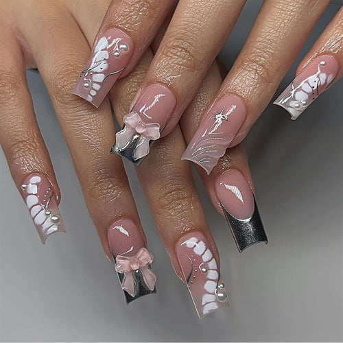 Glamorous artificial nails with elegant decorations Bowlift