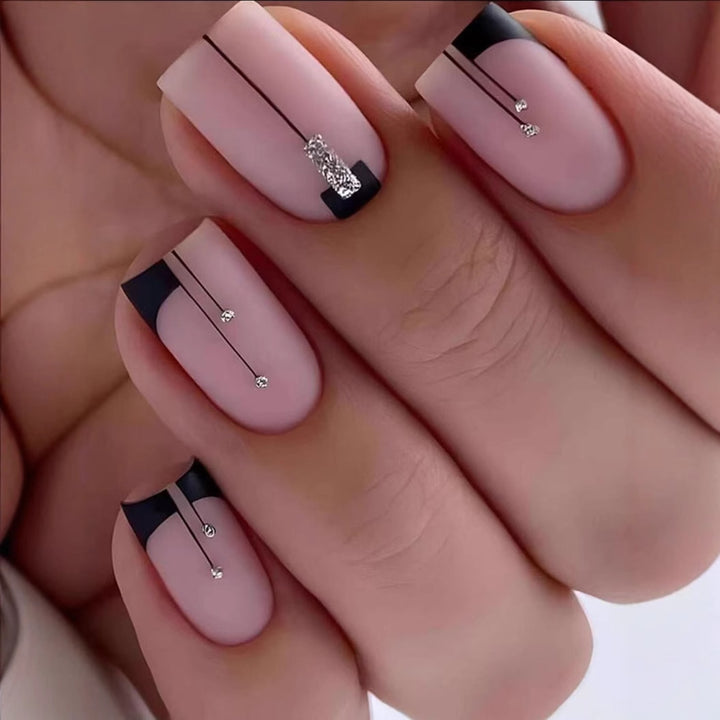 Acrylic nail set with elegant rhinestone accents and stylish lines Bowlift