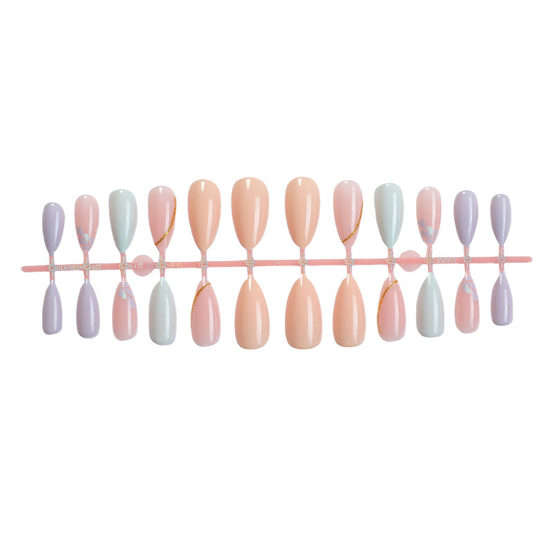 Artistic Press-On Nail Set with Gold Accent Designs Bowlift