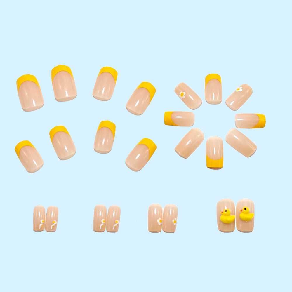 Artificial nails with playful duck motif and spring accents Bowlift