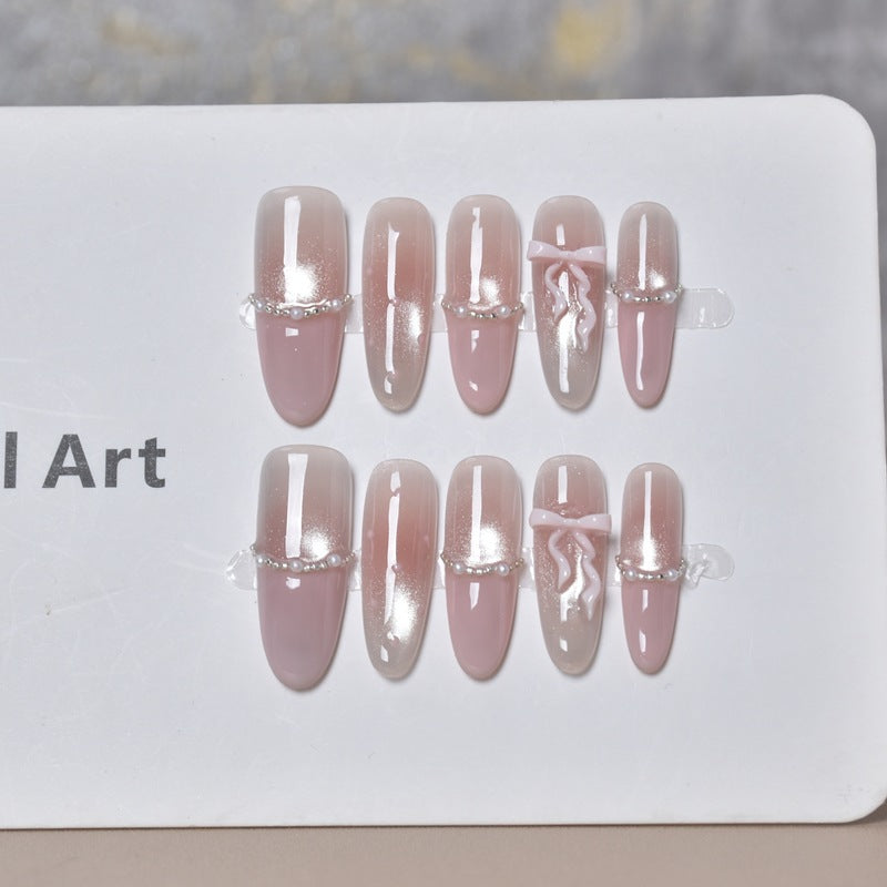 Elegant Long Press-On Nails with Decorative Accents Bowlift