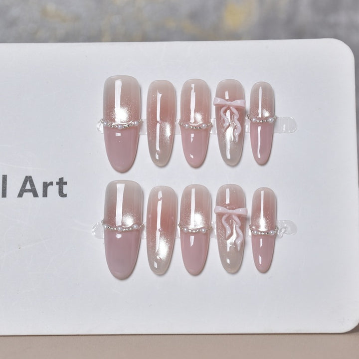 Elegant Long Press-On Nails with Decorative Accents Bowlift
