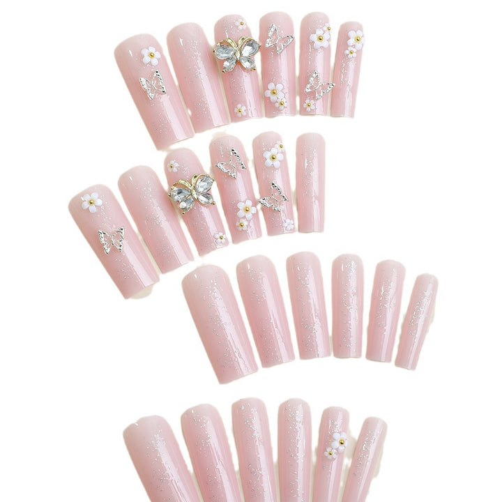 Artificial nail set with floral and glittering accents Bowlift