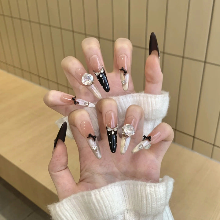 Artistic Stiletto Press-On Nail Art with Glimmering Accents Bowlift