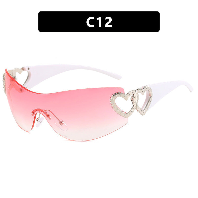 Ladies sporty sunglasses in trendy shield design with heart accents Bowlift