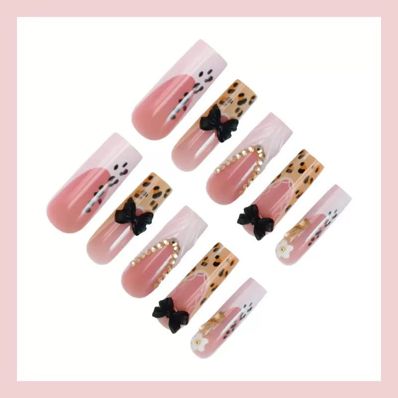 Artistic Press-On Nail Design with Bow and Animal Print Accents Bowlift