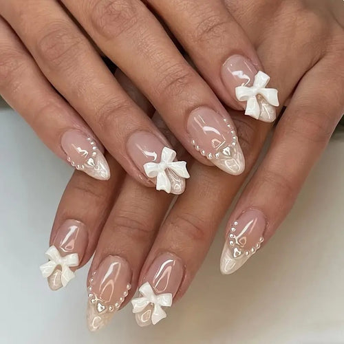 Artistic Press-On Nail Design with Bow Accents Bowlift